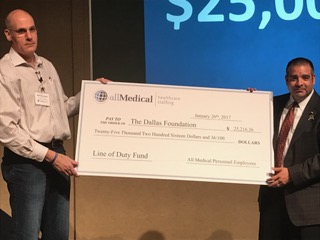 Neil presenting a check to The Dallas Foundation in 2017