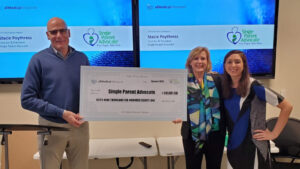 presentation of big check to single parent advocate