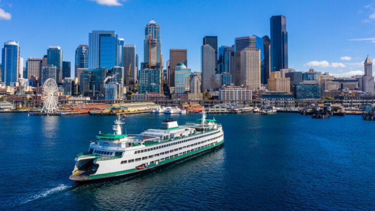 picture of downtown seattle with a ferry