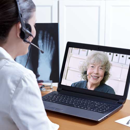 telehealth clinician talking to patient over video conference